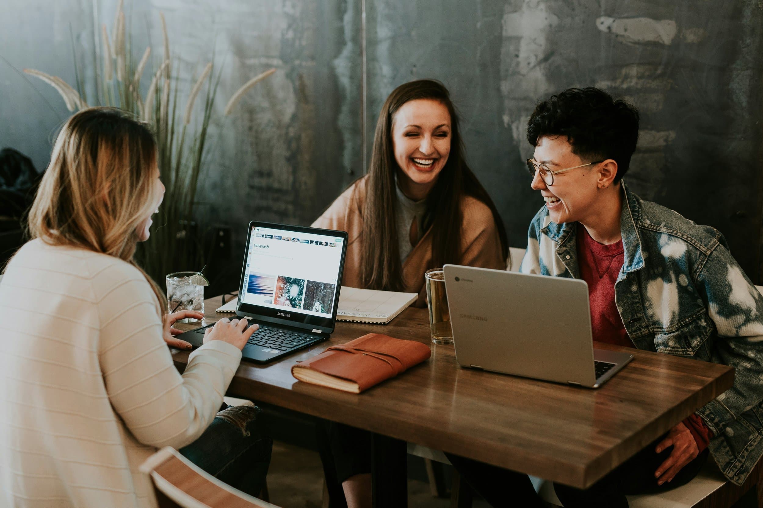 Coworkers laughing together at a table